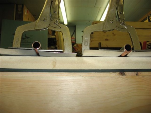 Our clamps holding the absorber tightly to the copper. 90% wrap on the left, 70% (standard) wrap on the right